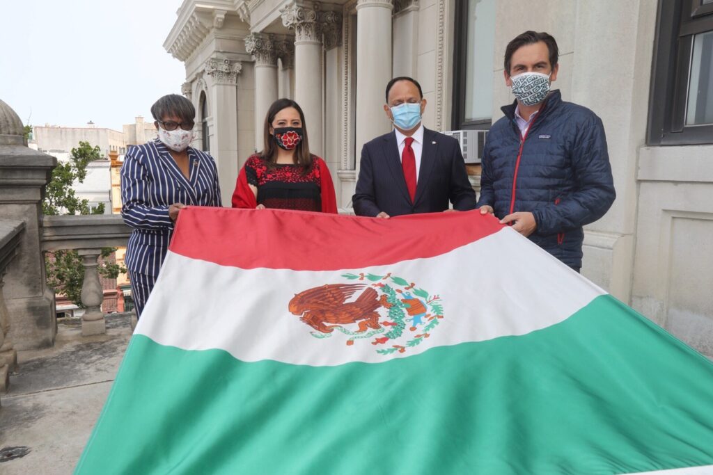 Mexican Flag Riasing. Mayor Fulop and Councilwoman Waterman along with Jorge Islas López and Ana Flores from the Mexican Conculate holding the Mexican flag