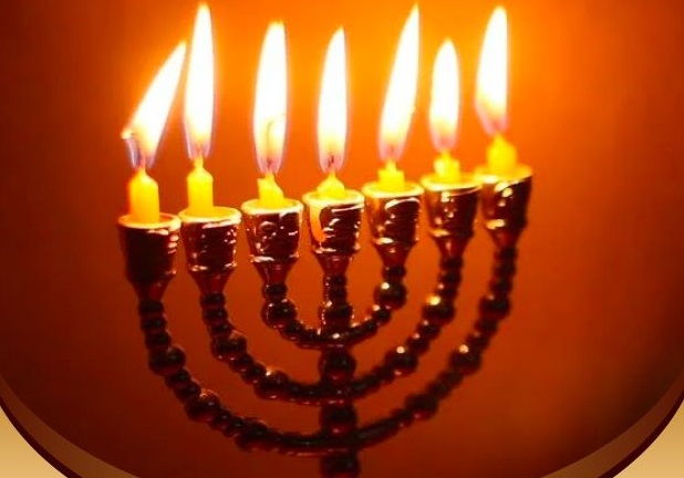 A picture of a fully lit menorah.