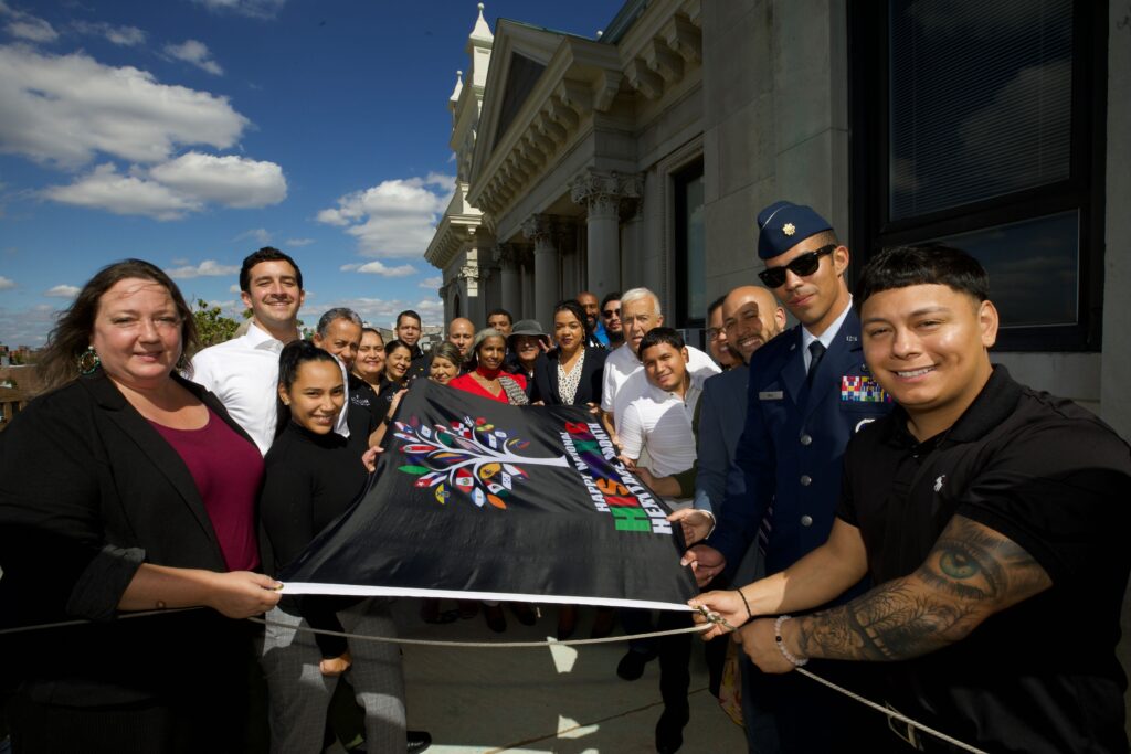 Group picture of the Hispanic Latino flag raising